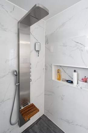 Marble and Navy Primary Ensuite, Courtice: Marble shower with body panel and niche