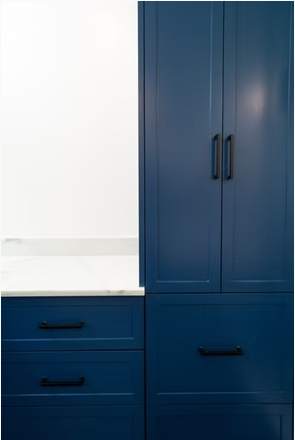 Marble and Navy Primary Ensuite, Courtice: Tall blue cabinet and drawers