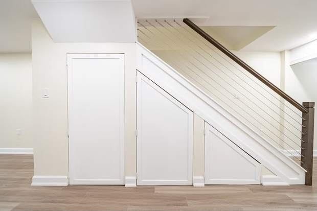 Stone Fireplace Basement Retreat, Oshawa: Staircase with built-in under-stair storage