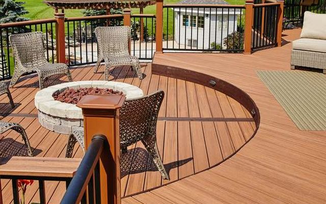 Composite deck with railing and fire pit seating