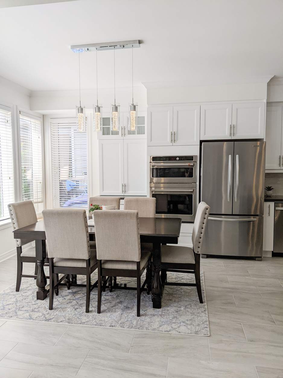 Chef's Kitchen and Entertainer's Basement, Whitby: Dining area with a linear pendant light beside the kitchen