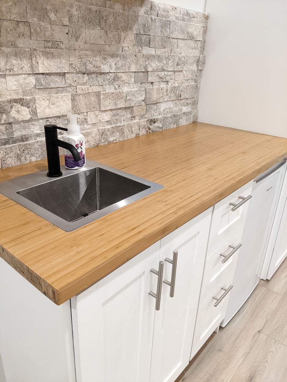 Chef's Kitchen and Entertainer's Basement, Whitby: Bamboo counter with a stainless bar sink and black faucet
