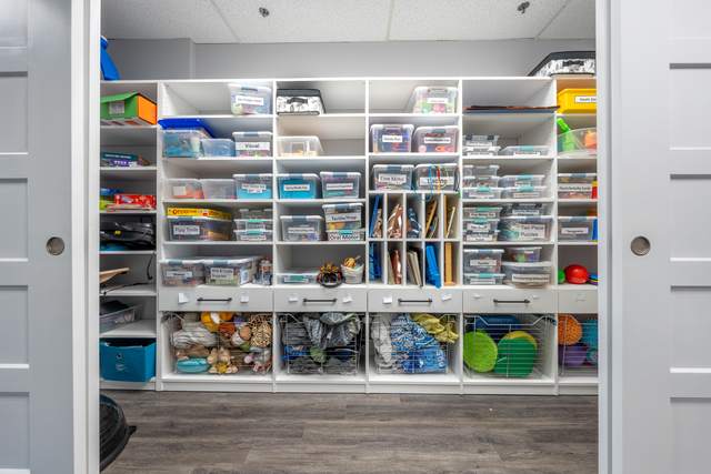 Dots for Kids Occupational Therapy Centre, Whitby: Close-up of labelled storage bins organizing therapy tools by category