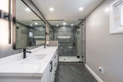 Slate Chevron Spa Bathroom, Ajax: Vanity mirror and shower with matte black fixtures