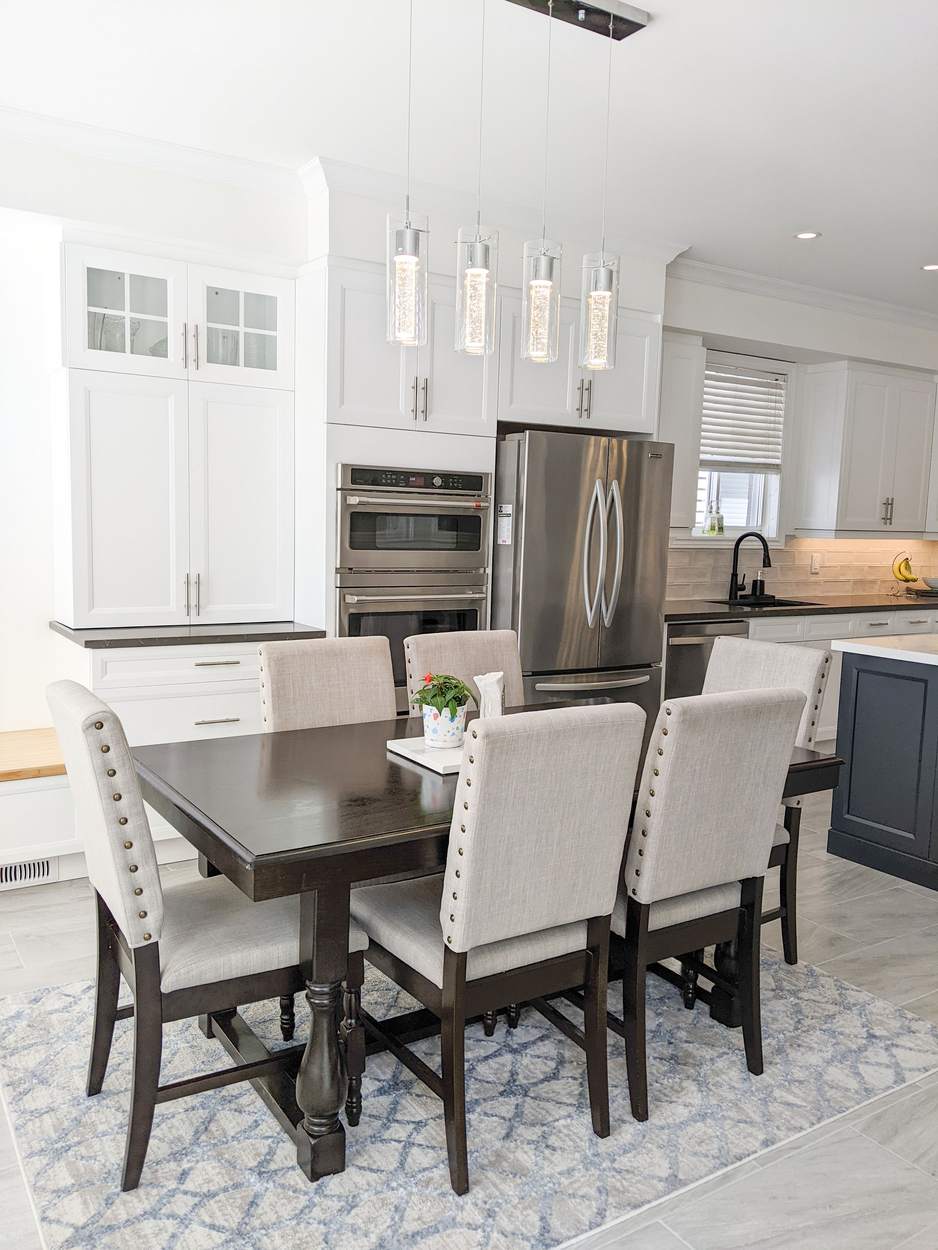 Chef's Kitchen and Entertainer's Basement, Whitby: Kitchen dining area with glass-front cabinets and stainless wall ovens
