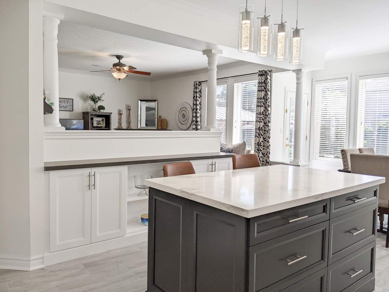 Chef's Kitchen and Entertainer's Basement, Whitby: Charcoal island with a light quartz top and a view through to the dining area