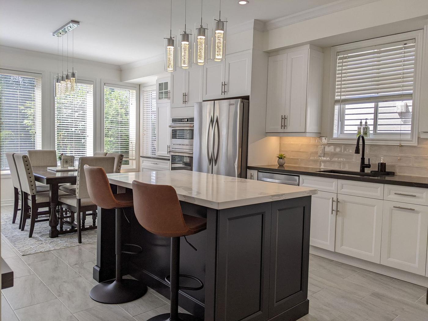 Chef's Kitchen and Entertainer's Basement, Whitby: Island seating with a view through to the sunlit dining area