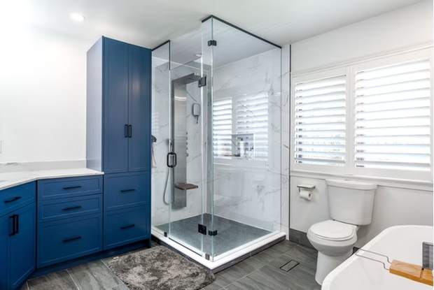 Marble and Navy Primary Ensuite, Courtice: Glass shower beside a freestanding tub