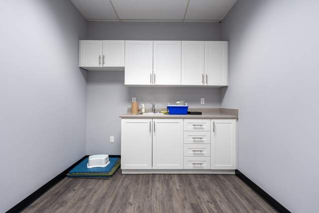 Dots for Kids Occupational Therapy Centre, Whitby: Utility nook with white cabinetry, a sink and stacked foam floor mats