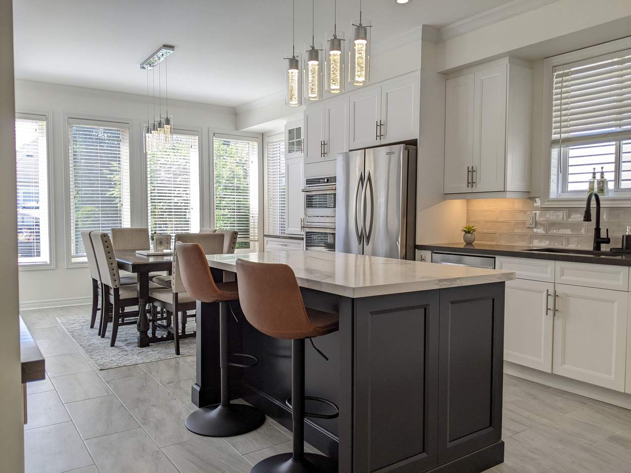Chef's Kitchen and Entertainer's Basement, Whitby: Open kitchen with island seating, pendant lights and a bright dining area
