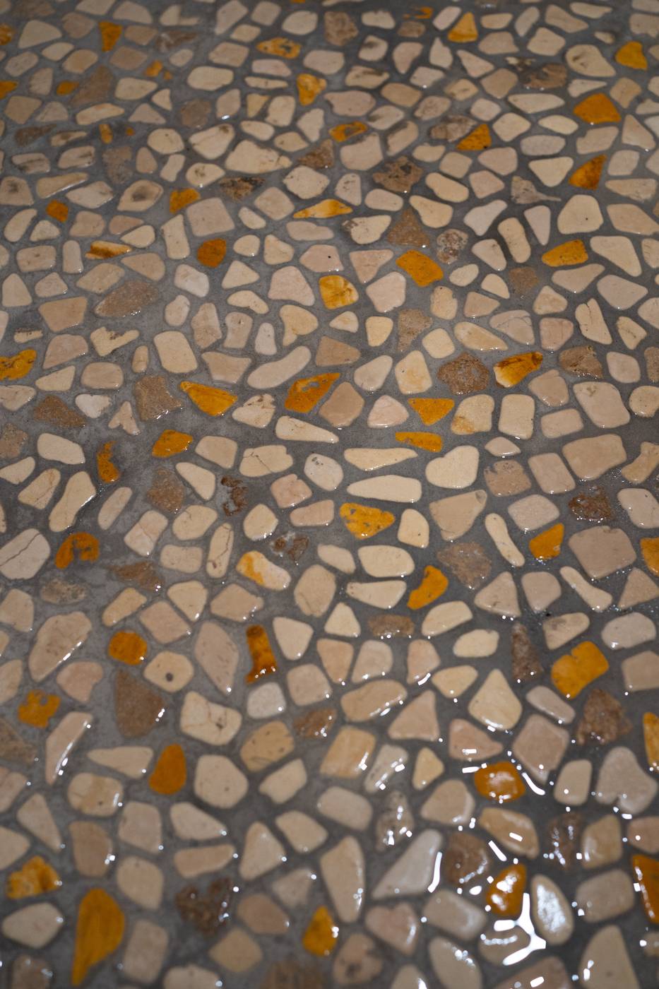 Taupe Herringbone Bathroom Retreat, Whitby: Natural stone pebble shower floor