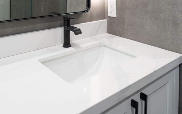White quartz vanity top with an undermount sink