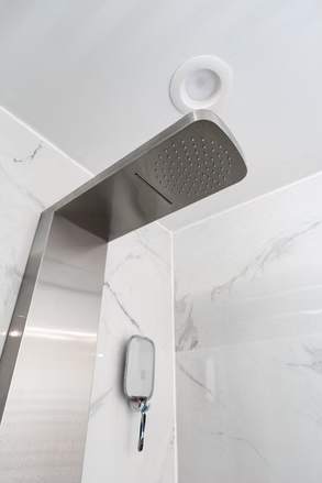 Marble and Navy Primary Ensuite, Courtice: Shower panel close-up on marble-look tile