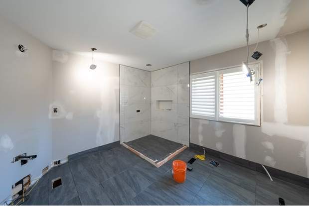 Marble and Navy Primary Ensuite, Courtice: Shower pan and floor tile in progress