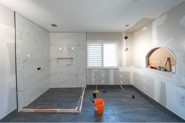 Marble and Navy Primary Ensuite, Courtice: Shower walls tiled before fixtures