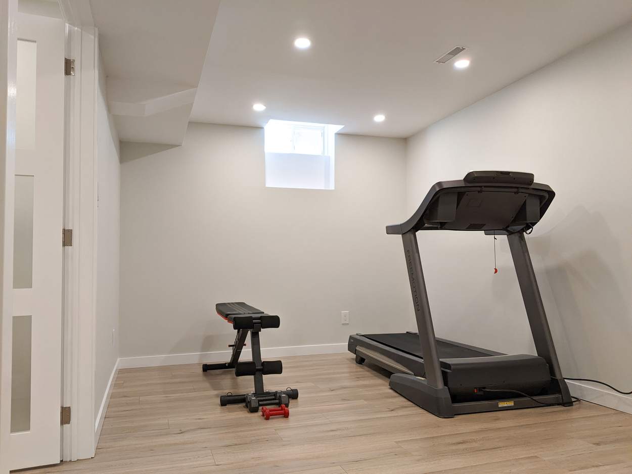 Chef's Kitchen and Entertainer's Basement, Whitby: Basement home gym with pot lights and vinyl plank flooring