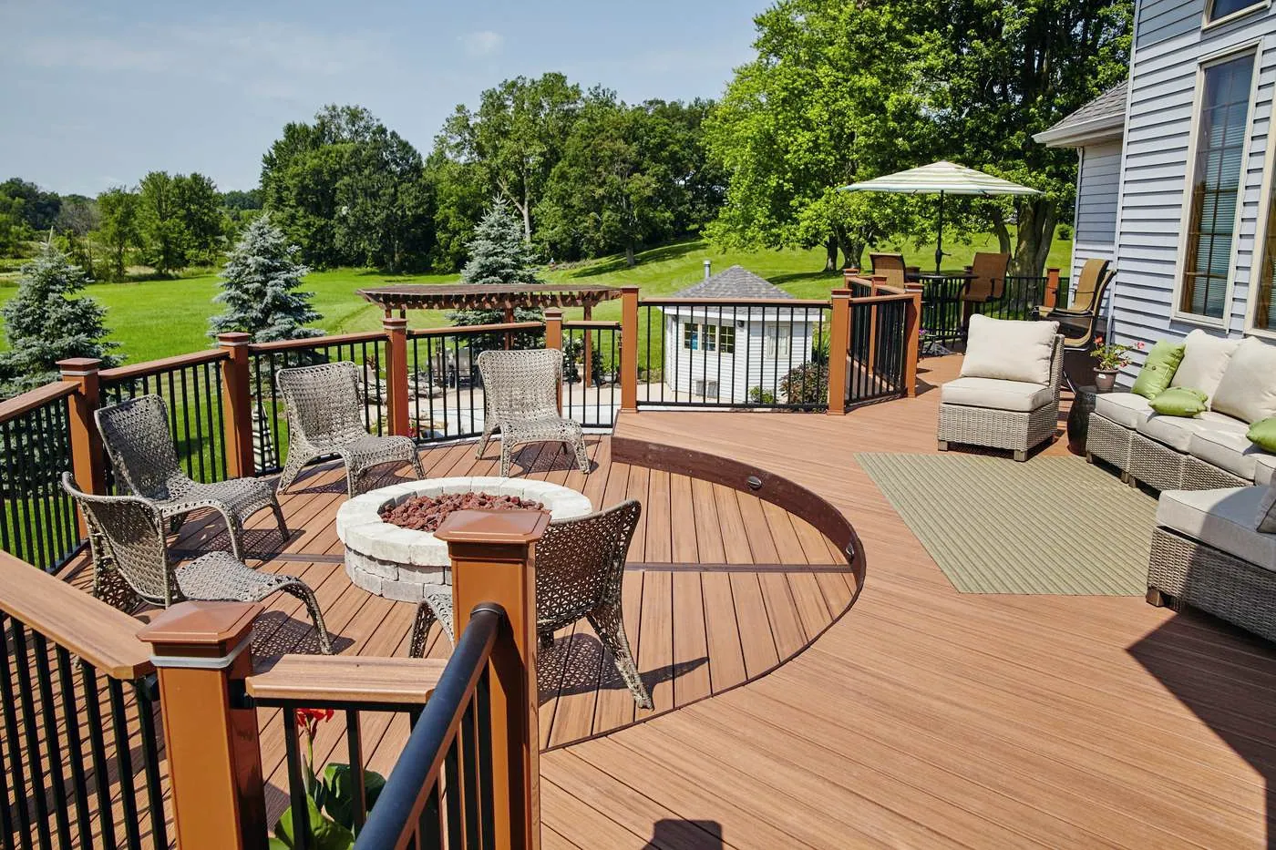 Backyard deck with railings and outdoor seating