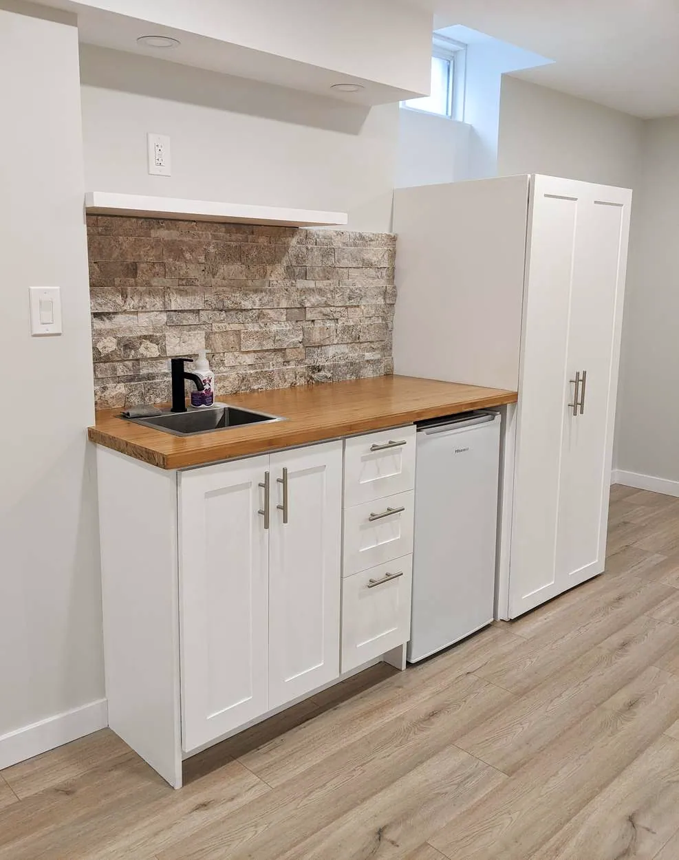 Chef’s Kitchen & Entertainer’s Basement, Whitby: Basement kitchenette with a bamboo counter and stone backsplash