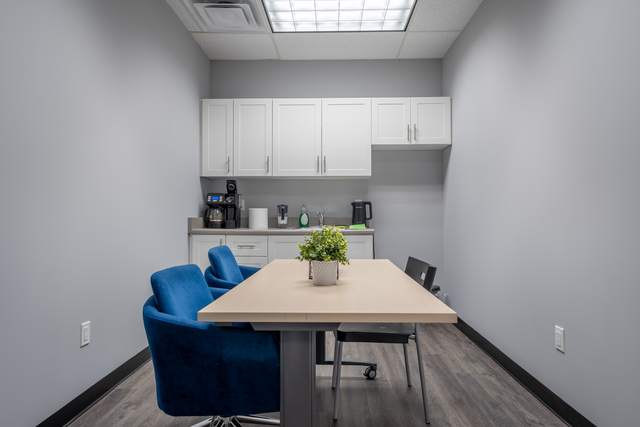 Dots for Kids Occupational Therapy Centre, Whitby: Staff kitchenette with white cabinetry, coffee maker and a break table
