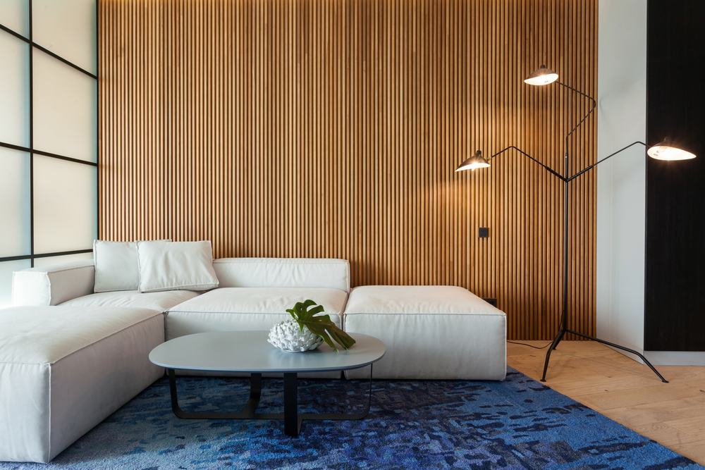 Modern interior with a warm wood slat feature wall and modular seating