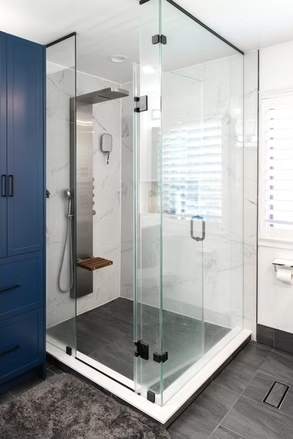 Marble and Navy Primary Ensuite, Courtice: Corner glass shower with a teak bench