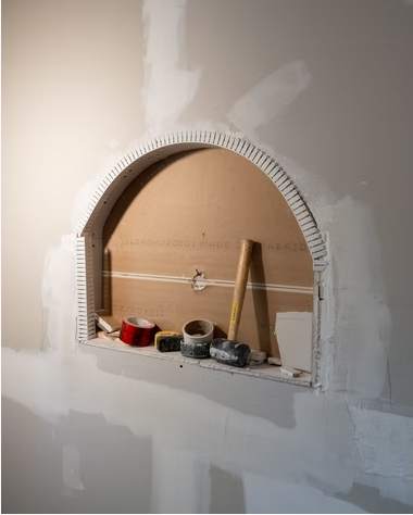 Marble and Navy Primary Ensuite, Courtice: Arched niche before finishing