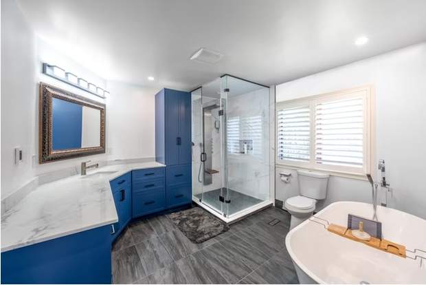 Marble and Navy Primary Ensuite, Courtice: Wide view of the bathroom with vanity, shower and tub