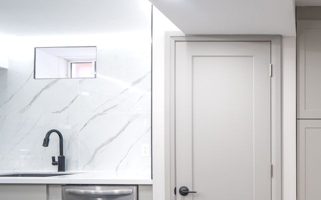 Marble-look porcelain slab backsplash