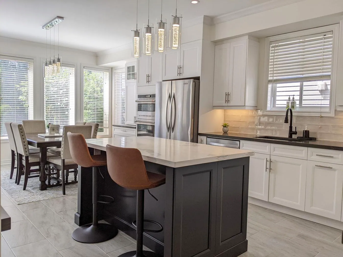 Chef’s Kitchen & Entertainer’s Basement, Whitby: Island seating with a view through to the sunlit dining area