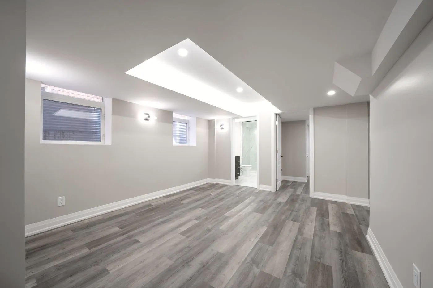 Living area with a tray ceiling and cove lighting, freshly painted