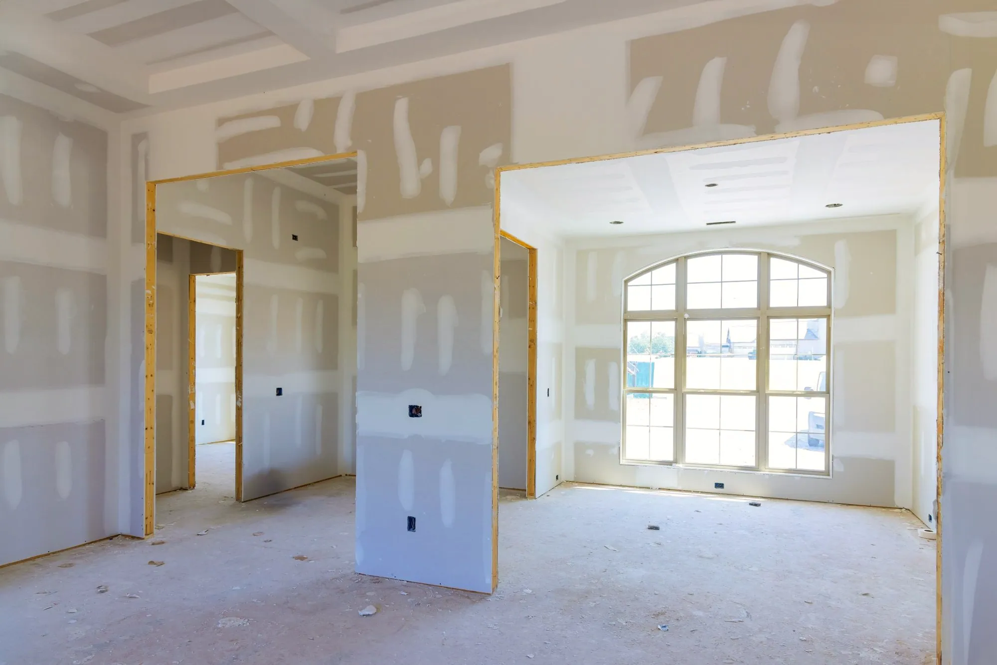 New rooms with drywall hung, taped and mudded, ready for sanding and paint