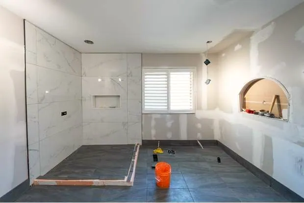 Marble and Navy Primary Ensuite, Courtice: Shower walls tiled before fixtures