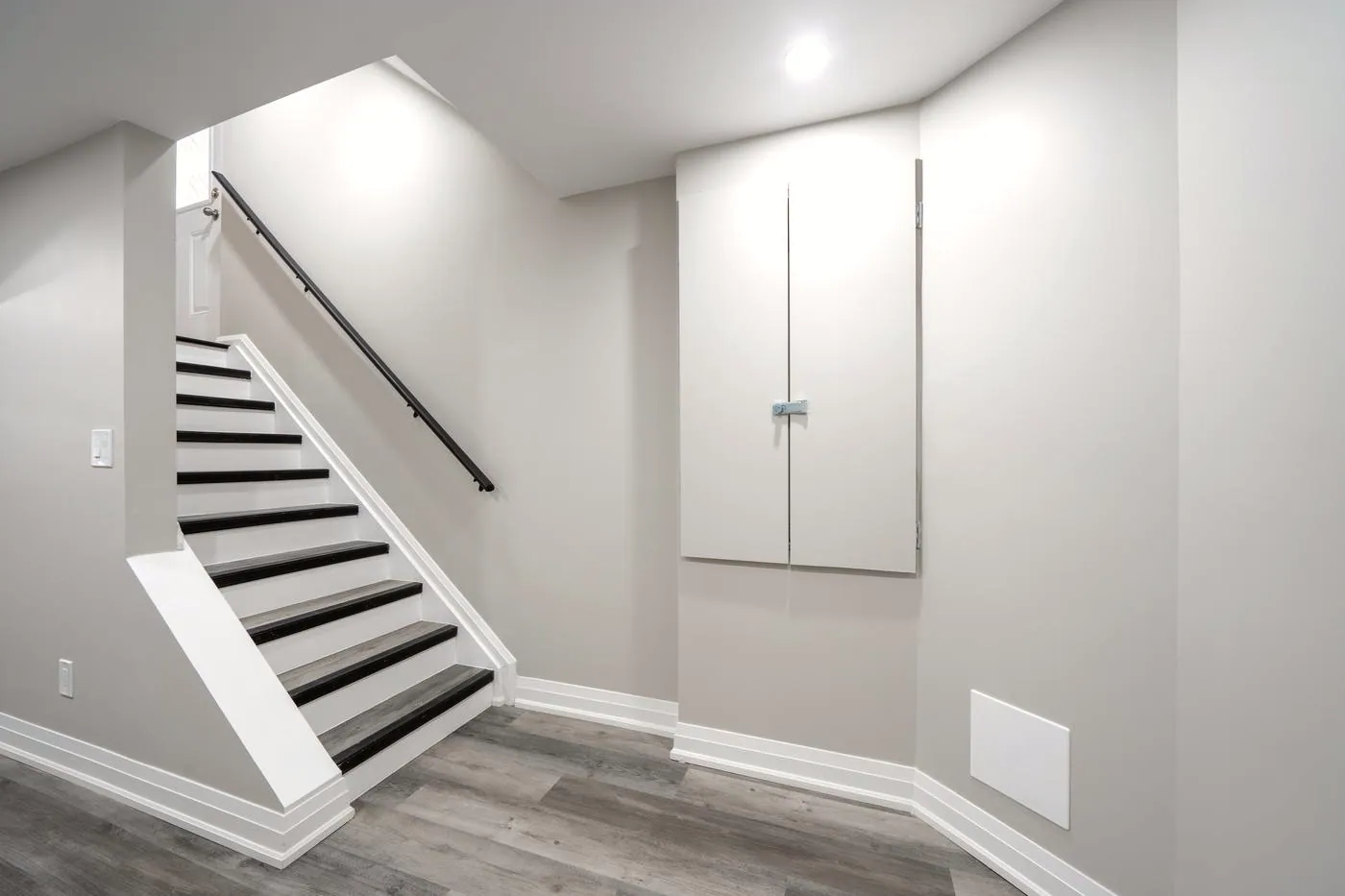Staircase with a black handrail, Oshawa