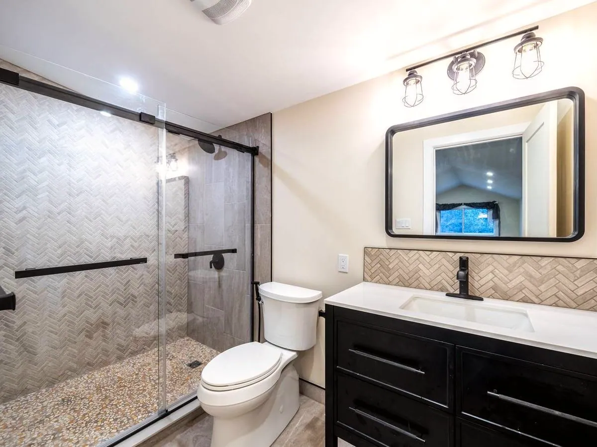 Warm taupe and black: herringbone accent tile